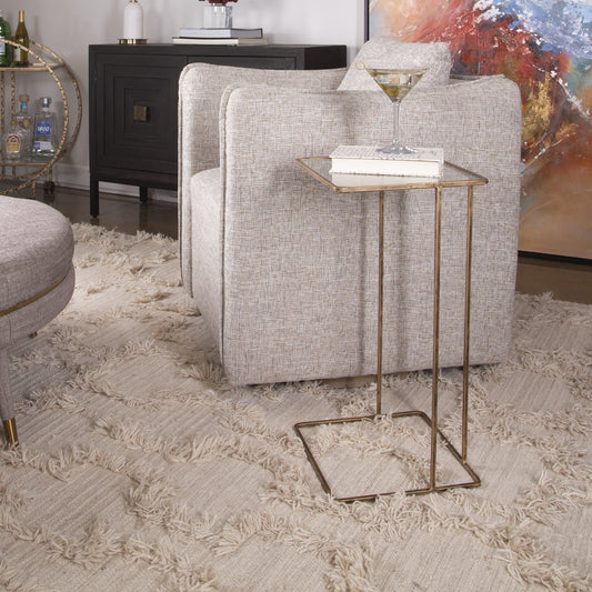 Cadmus Table by Uttermost in gold. Made from iron, glass in a modern style.