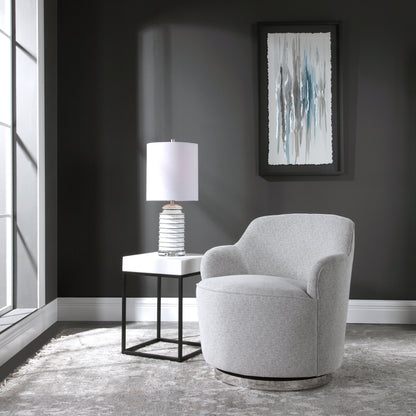 Hobart Casual Swivel Chair by Uttermost. Made from plywood, stainless steel, fabric, foam in a modern style.