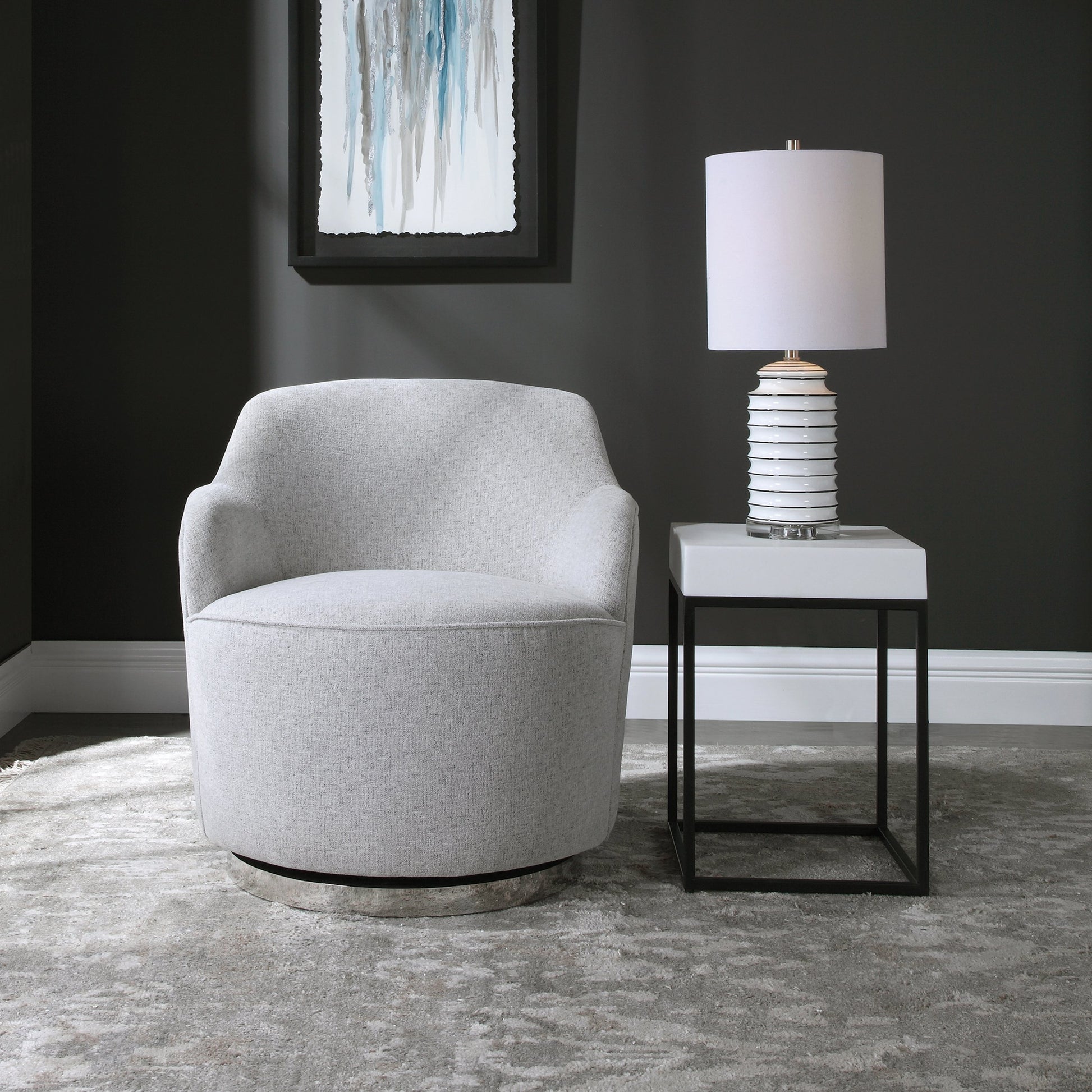 Hobart Casual Swivel Chair by Uttermost. Made from plywood, stainless steel, fabric, foam in a modern style.