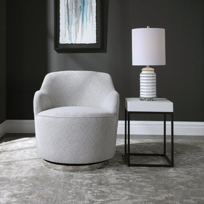 Hobart Casual Swivel Chair by Uttermost. Made from plywood, stainless steel, fabric, foam in a modern style.