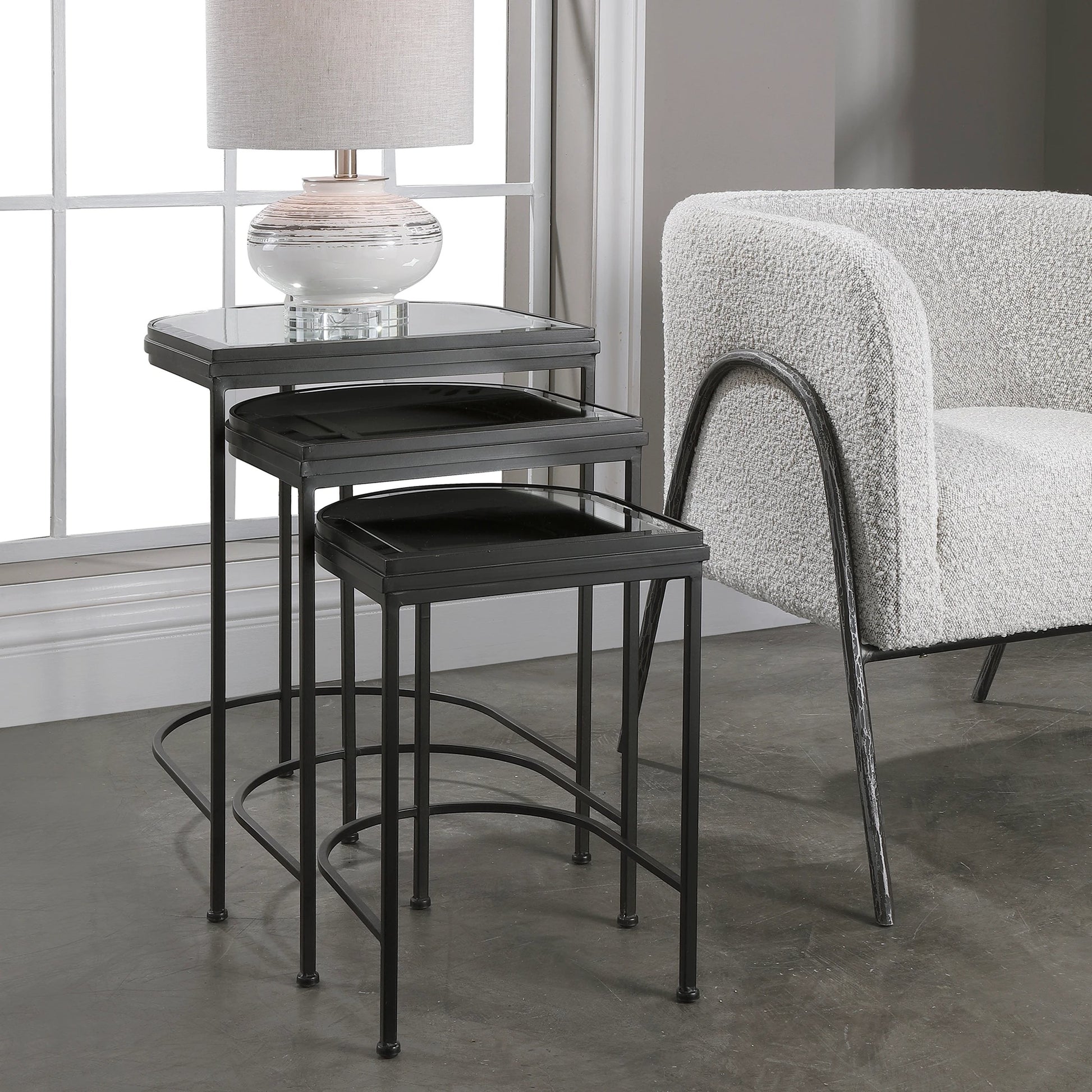 India Nesting Tables by Uttermost in antique brushed gold. Made from mirror 45%, iron 55% in a transitional style.