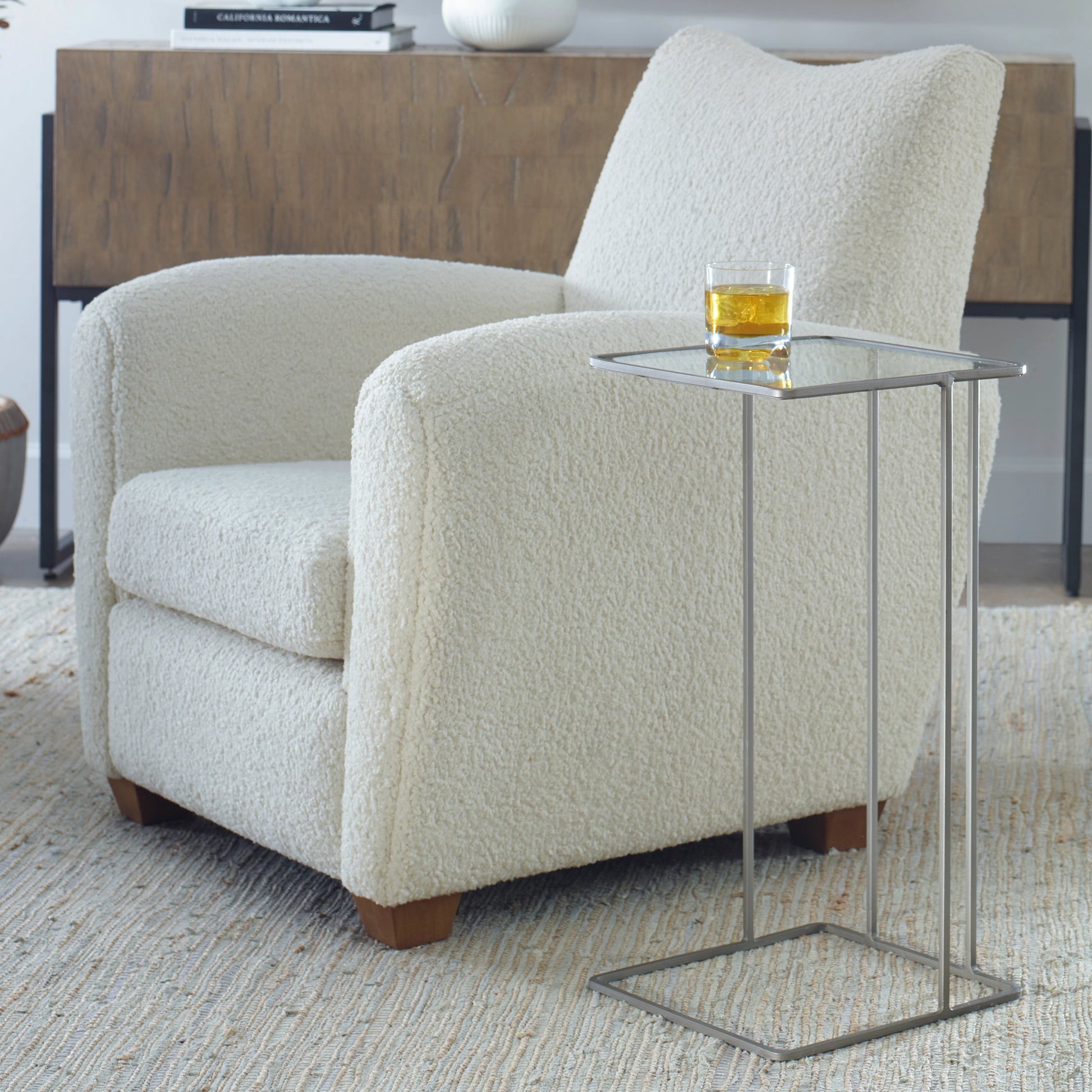 Cadmus Accent Table by Uttermost in black. Made from iron, glass in a modern style.