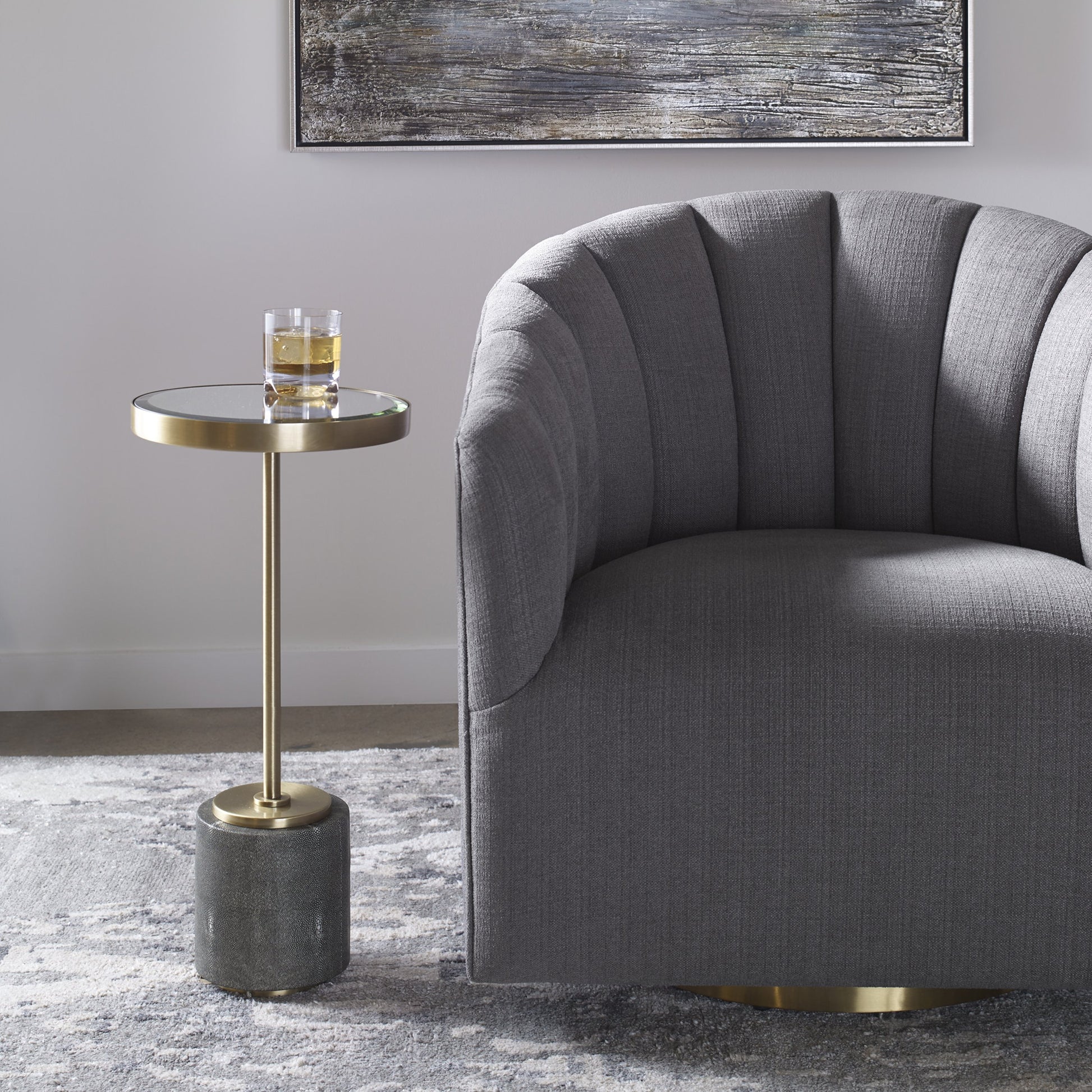Laurier Accent Table by Uttermost in brass. Made from 50% iron, 15% glass, 10% faux ful, 25% pine wood in a transitional style.