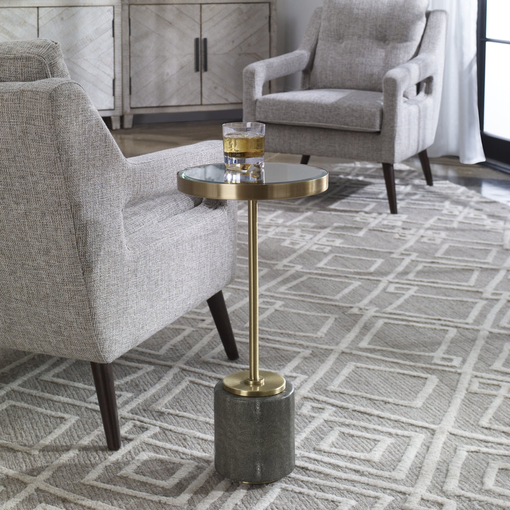 Laurier Accent Table by Uttermost in brass. Made from 50% iron, 15% glass, 10% faux ful, 25% pine wood in a transitional style.