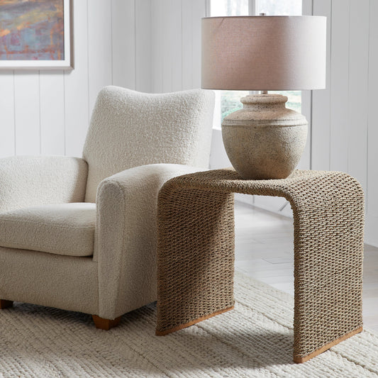 Calabria End Table by Uttermost in woven seagrass. Made from woven seagrass, mango wood, metal in a coastal style.