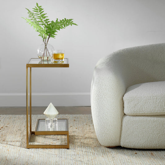 Musing Accent Table by Uttermost in brushed brass. Made from iron, glass in a modern style.