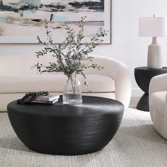 Bongo Coffee Table by Uttermost in black. Made from core with fabric furing in a modern style.