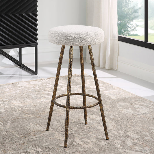 Braven Counter Stool by Uttermost in gold. Made from metal, mdf, foam, fabric in a modern style.