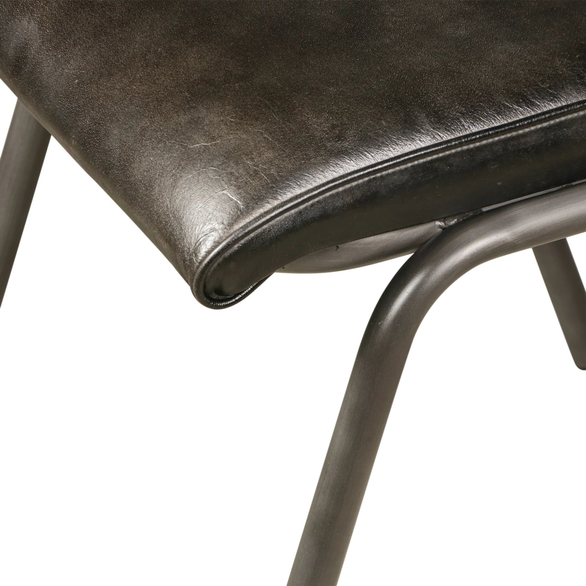 William Dining Chair by World Interiors in black, silver. Made from leather, iron in a unique style.