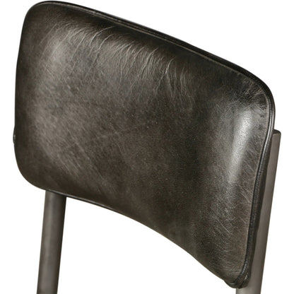 William Dining Chair by World Interiors in black, silver. Made from leather, iron in a unique style.