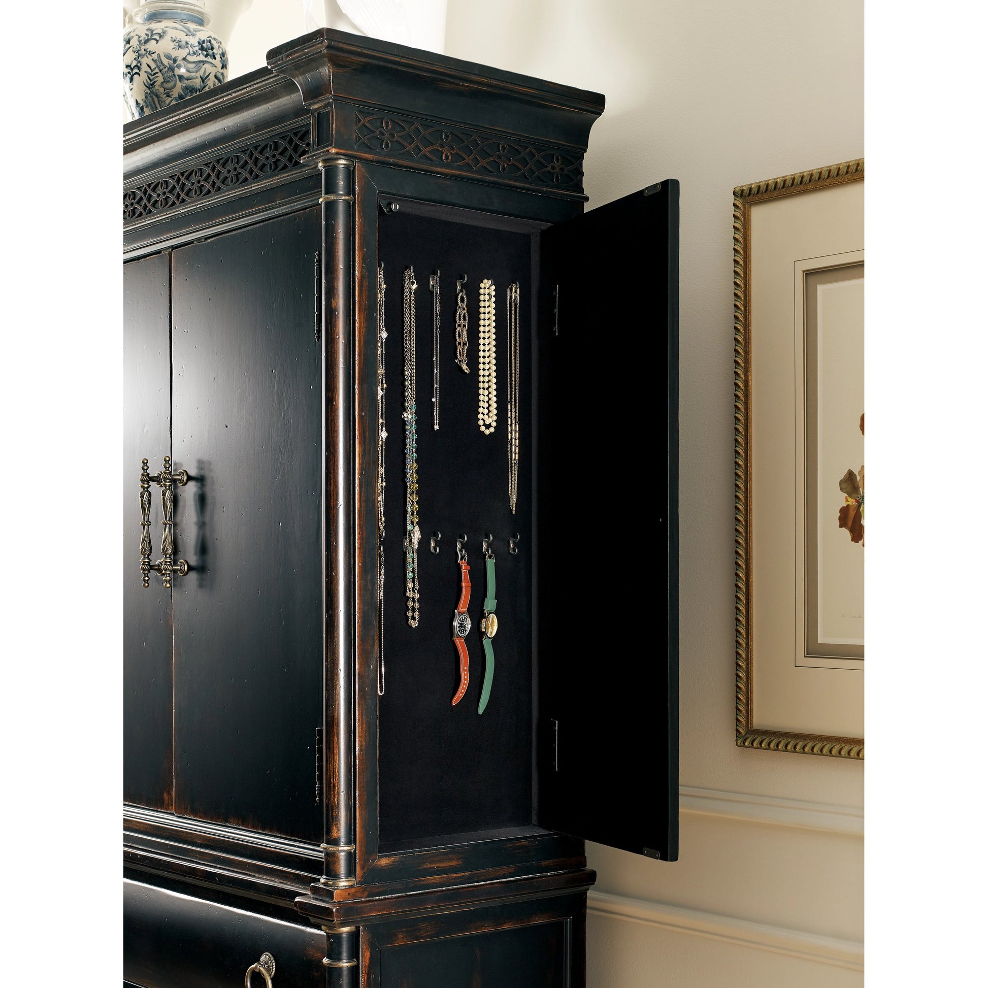 Charleston Jewelry Armoire by Hooker Furniture in black cherry. Made from cherry veneers, cedar, metal in a traditional style.