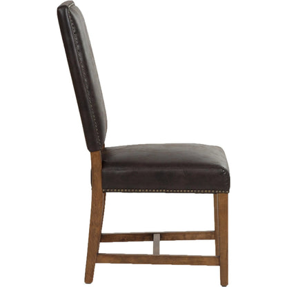 Dani Dining Chair by World Interiors in earth. Made from top grain pig leather, birch wood, metal, foam in a traditional style.