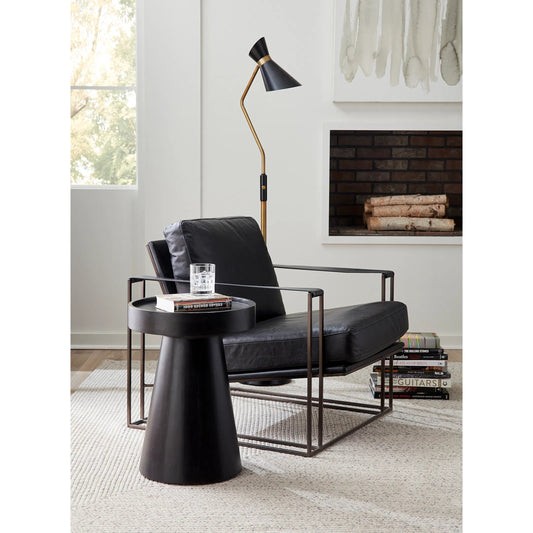Portlando Armchair by World Interiors in black and matte brown. Made from cowhide leather, iron in a modern style.