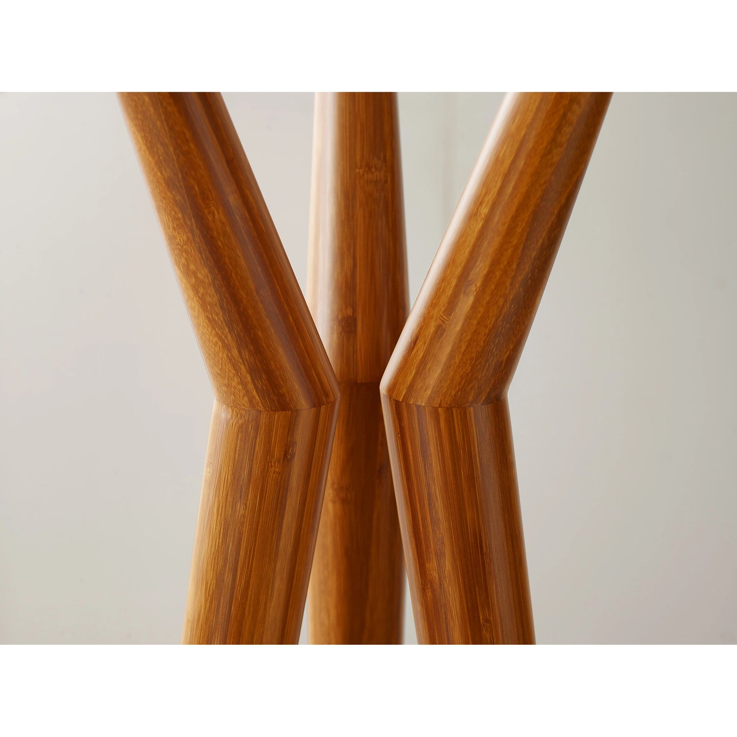 002 SI-1991848 | Closeup | Spire Coat Tree by Greenington in amber. Made from solid moso bamboo in a modern style.
