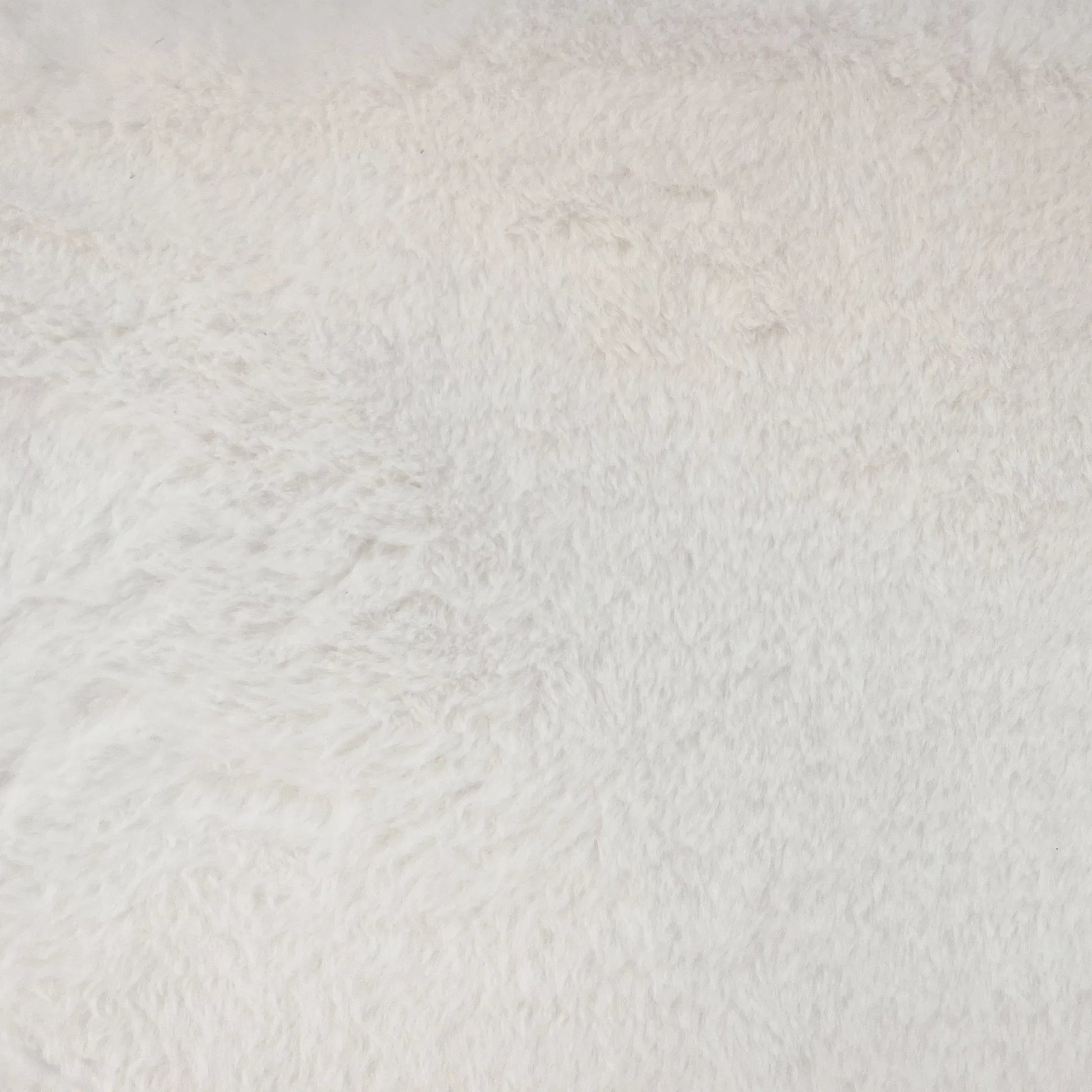 White Faux Fur Bench by Zentique in white faux fur. Made from faux fur in a transitional style.