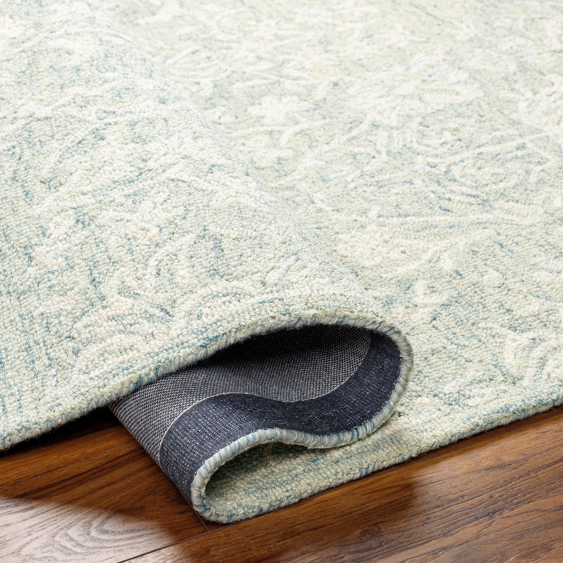 Granada Rug - 29983 by Livabliss in teal, light green, cream. Made from 100% wool in a unique style.