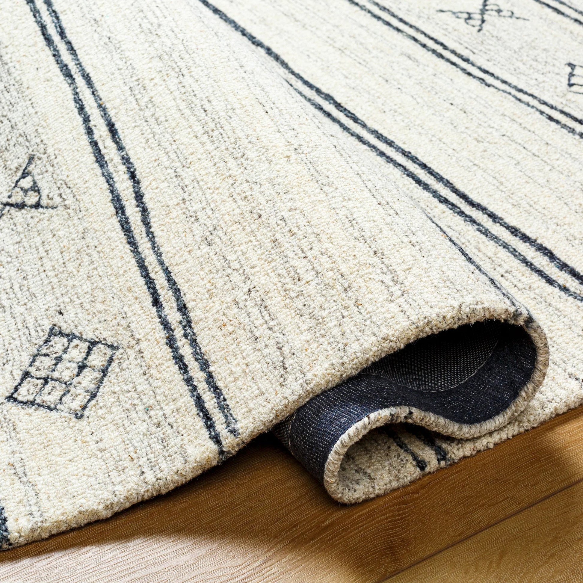 Granada Rug - 32650 by Livabliss in cream, black, charcoal. Made from main: 100% wool in a unique style.