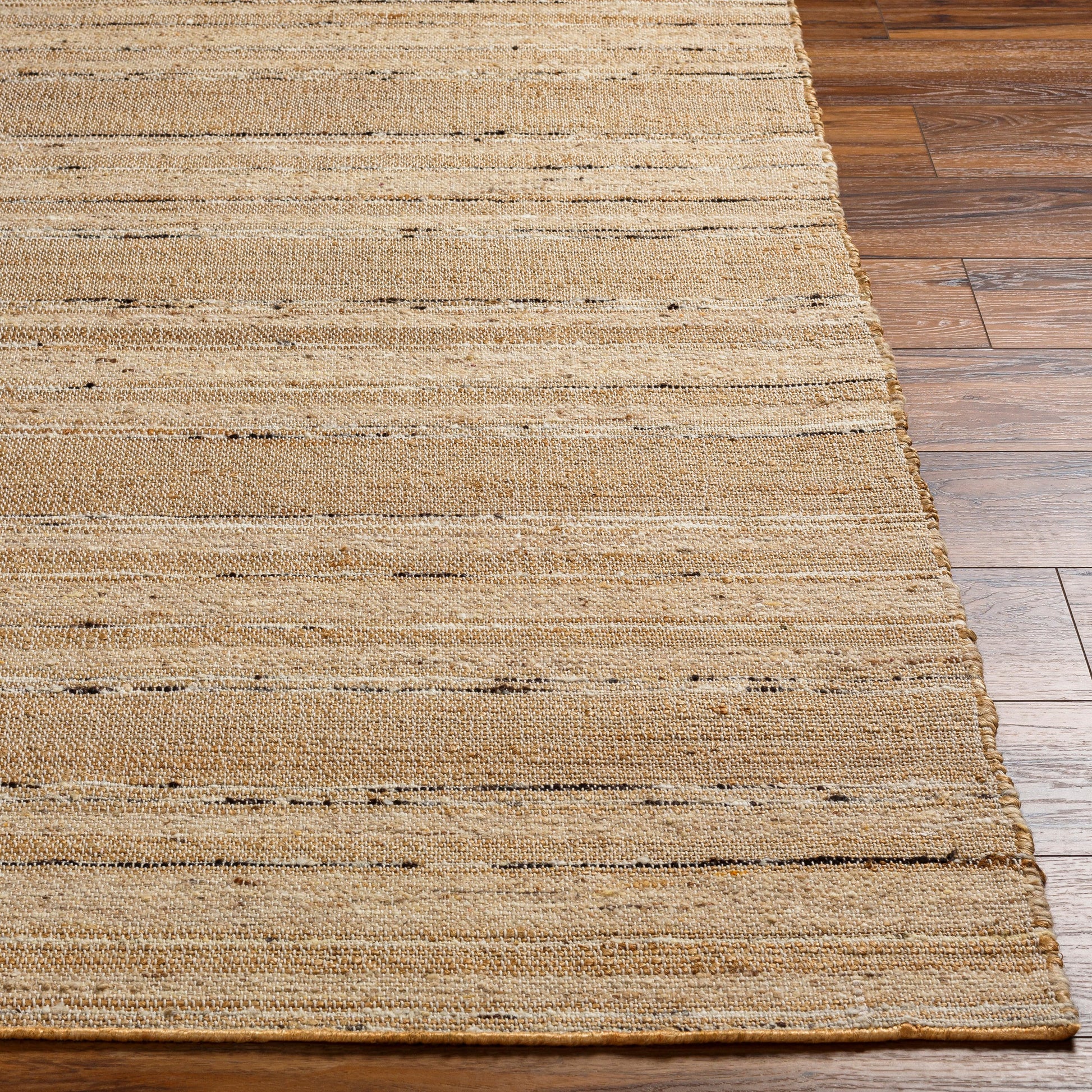 Geneva Rug by Surya in black, charcoal, peach, light beige. Made from 60% jute, 40% wool in a modern style.