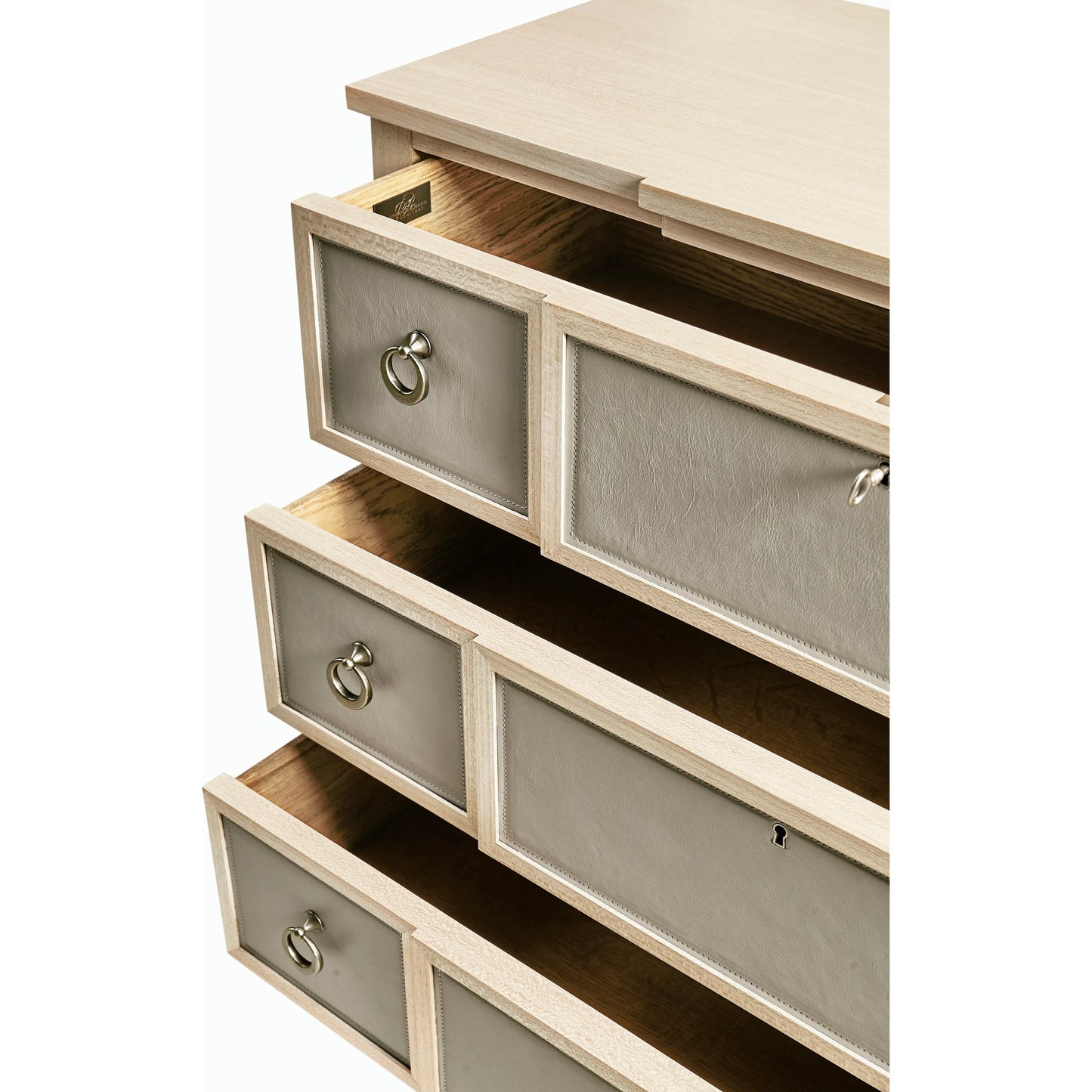 003 SI-2186251 | Closeup | Water Neap Leather Front Chest by Jonathan Charles in ash blonde. Made from died koto veneer, leather, brass in a transitional style.