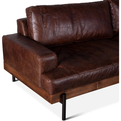 Chiavari Industrial Vintage Dark Brown Leather Sofa by World Interiors in geisha brown, antique zinc, medium walnut. Made from leather, foam, oak wood & iron in a transitional style.