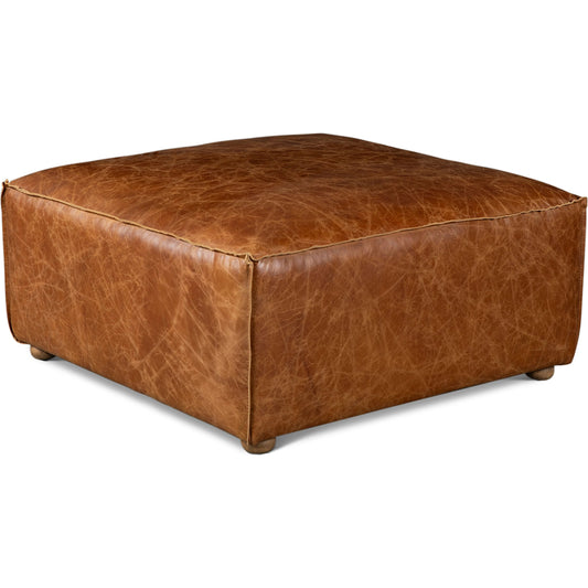 Chiavari Ottoman by World Interiors in brown and coco brown. Made from leather, foam, wood in a traditional style.