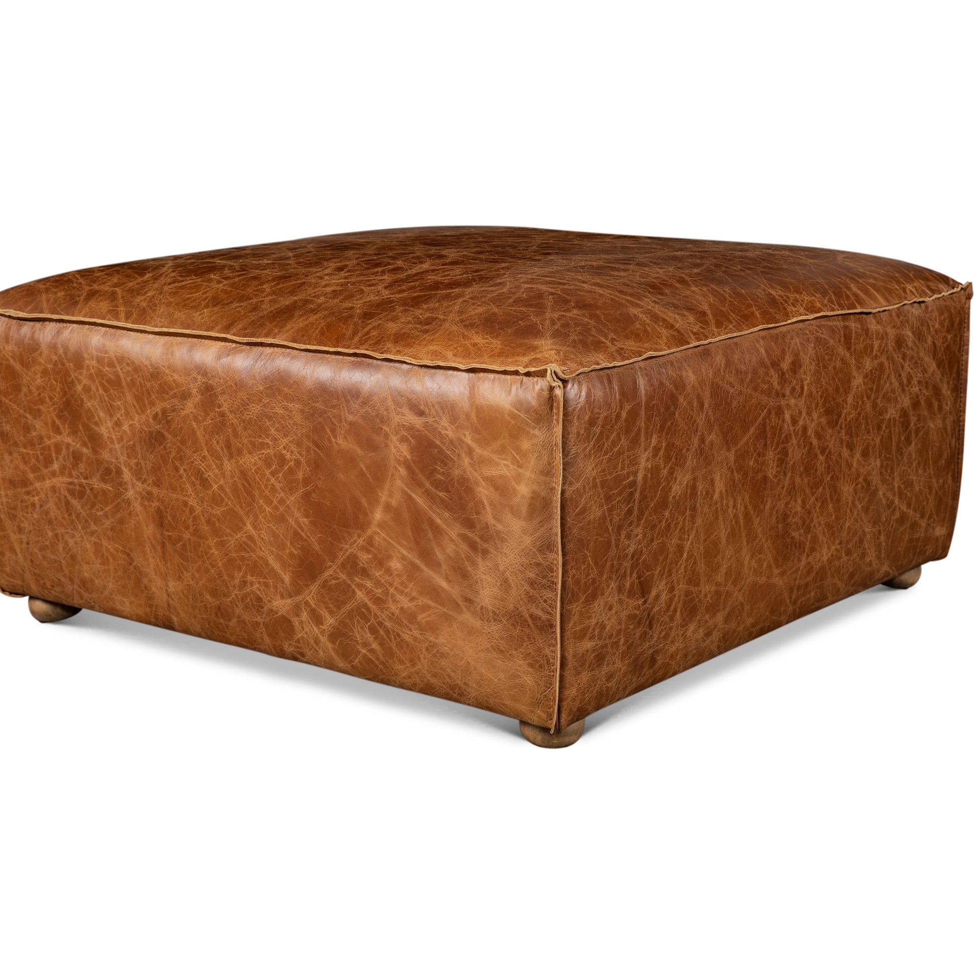 Chiavari Ottoman by World Interiors in brown and coco brown. Made from leather, foam, wood in a traditional style.
