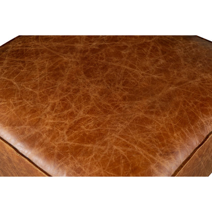 Chiavari Ottoman by World Interiors in brown and coco brown. Made from leather, foam, wood in a traditional style.