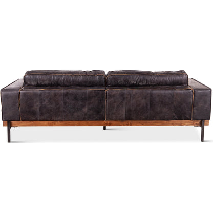 Chiavari Antique Leather Sofa by World Interiors in black and matte. Made from leather, foam, oak wood, iron in a modern style.