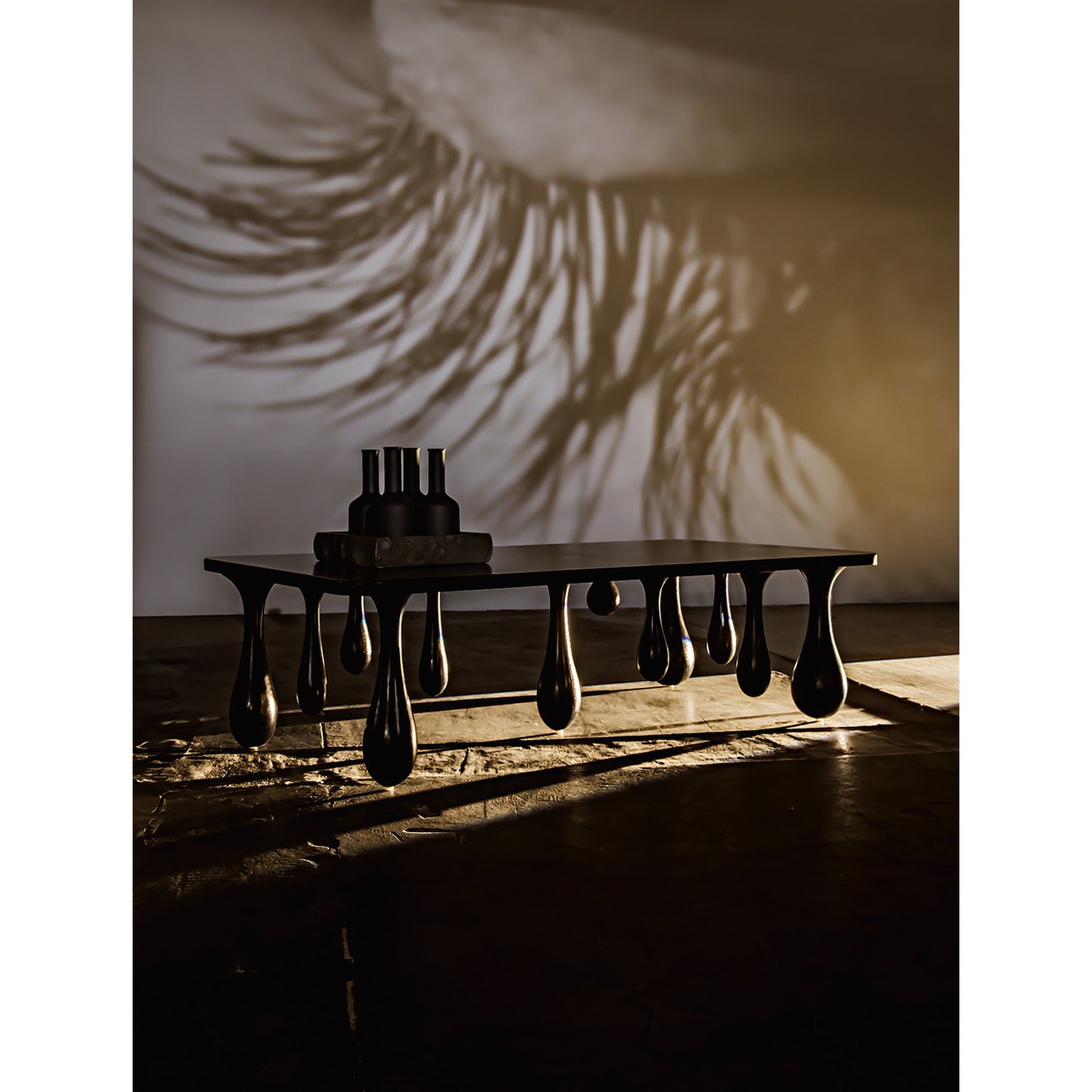 005 SR-834008 | Lifestyle | Drop Coffee Table by Noir in hand rubbed black. Made from mahogany in a modern style.