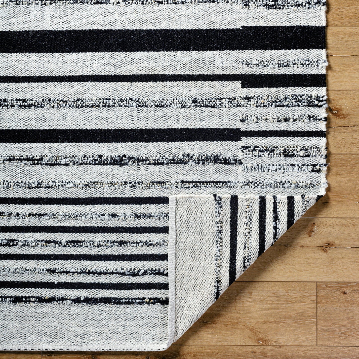 005 SI-2131745,SI-2131746,SI-2131747,SI-2131748 | Closeup | Goteborg GTG-2300 Rug by Surya in ivory, black. Made from face: 80% wool, 20% cotton, warp: 20% cotton in a unique style.