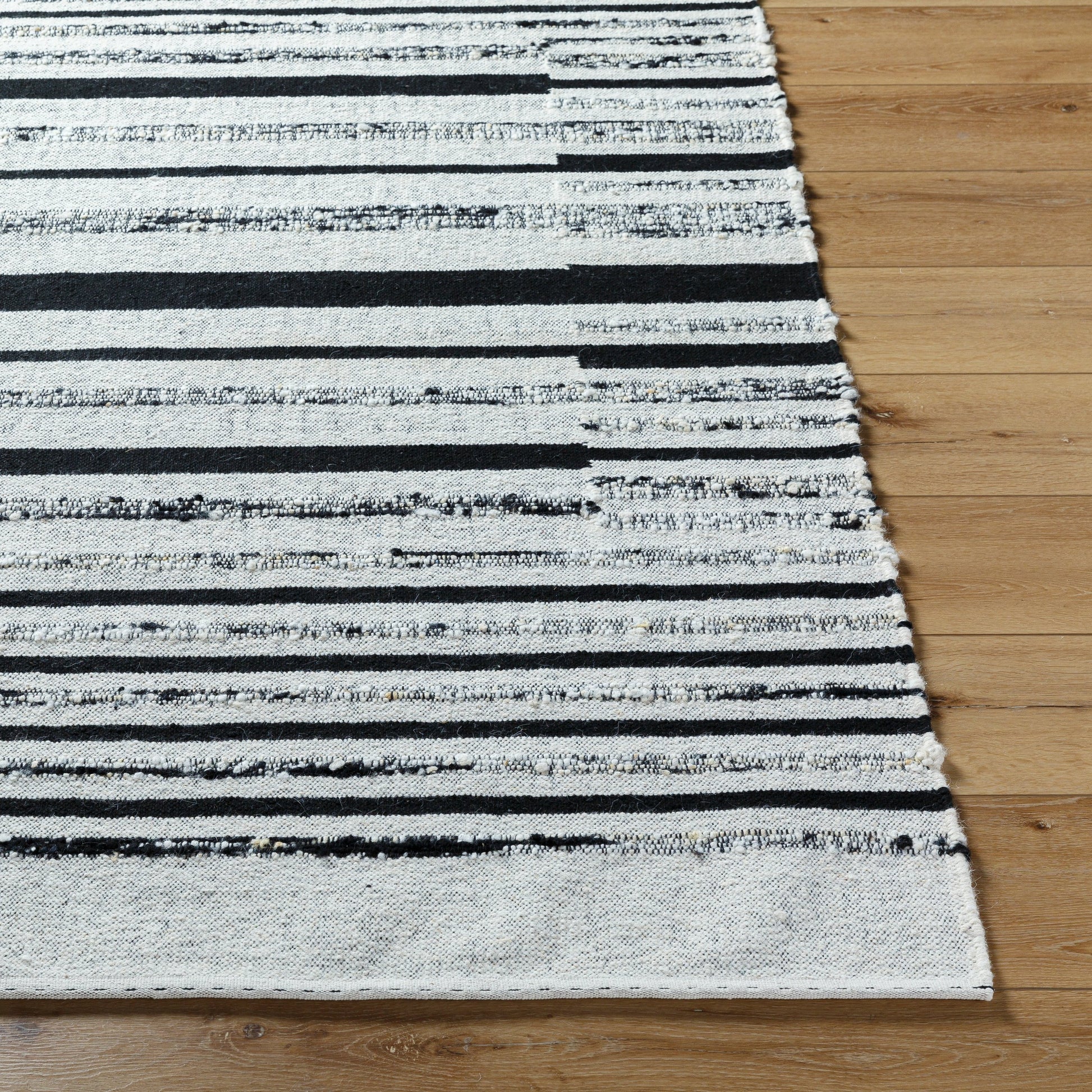 Goteborg GTG-2300 Rug by Surya in ivory, black. Made from face: 80% wool, 20% cotton, warp: 20% cotton in a unique style.