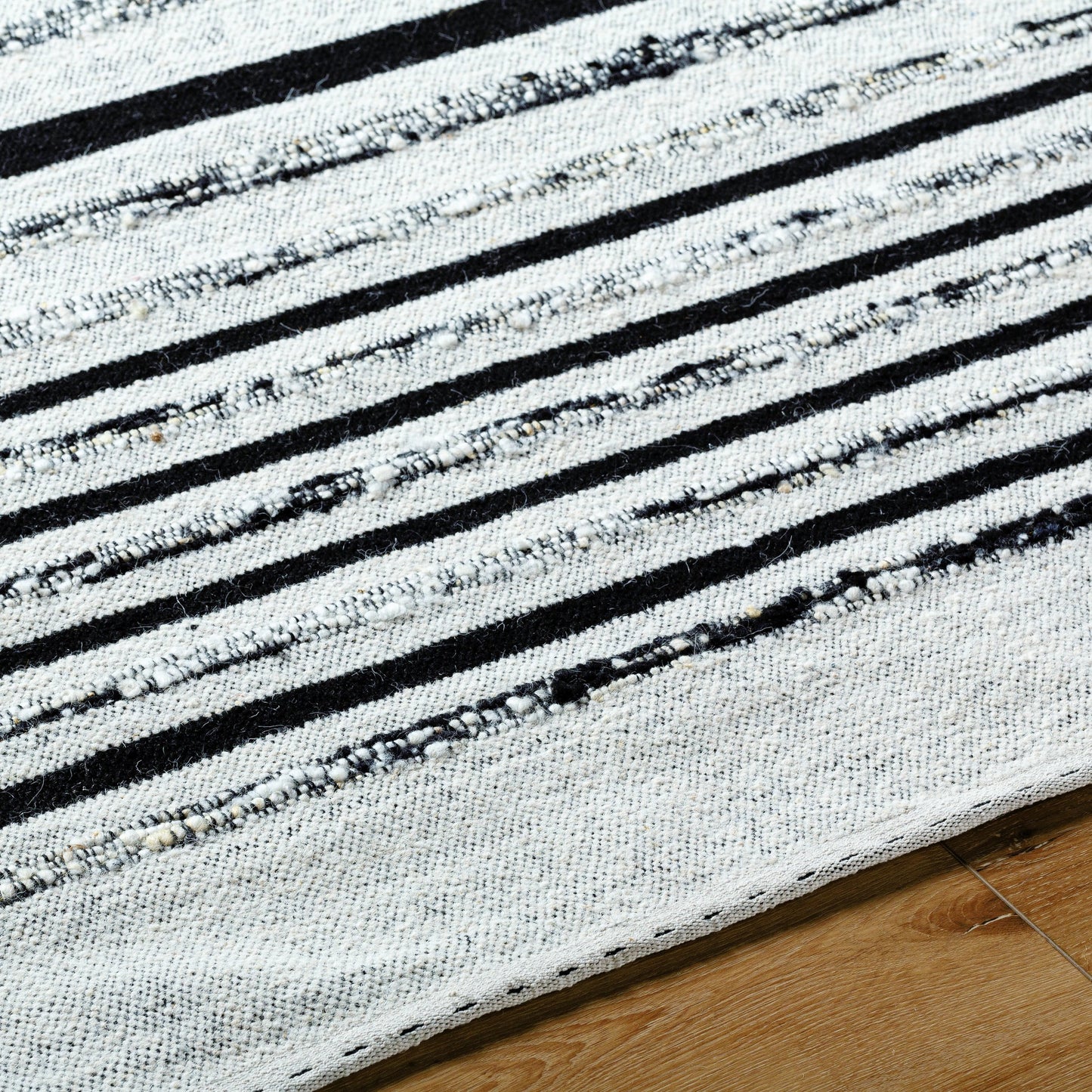 006 SI-2131745,SI-2131746,SI-2131747,SI-2131748 | Closeup | Goteborg GTG-2300 Rug by Surya in ivory, black. Made from face: 80% wool, 20% cotton, warp: 20% cotton in a unique style.