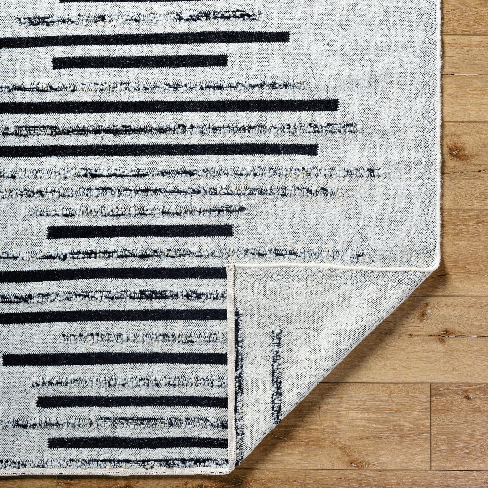 Goteborg GTG-2301 Rug by Surya in ivory, black. Made from face: 80% wool, 20% cotton, warp: 20% cotton in a unique style.