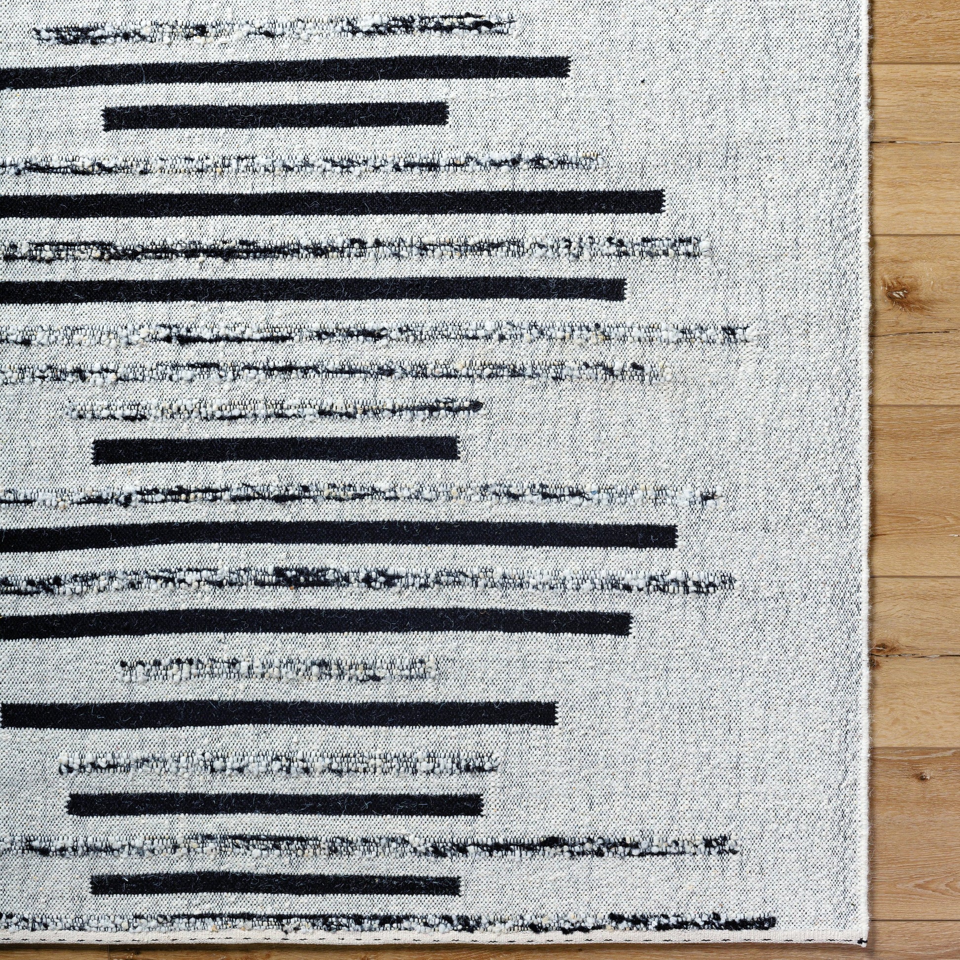 Goteborg GTG-2301 Rug by Surya in ivory, black. Made from face: 80% wool, 20% cotton, warp: 20% cotton in a unique style.