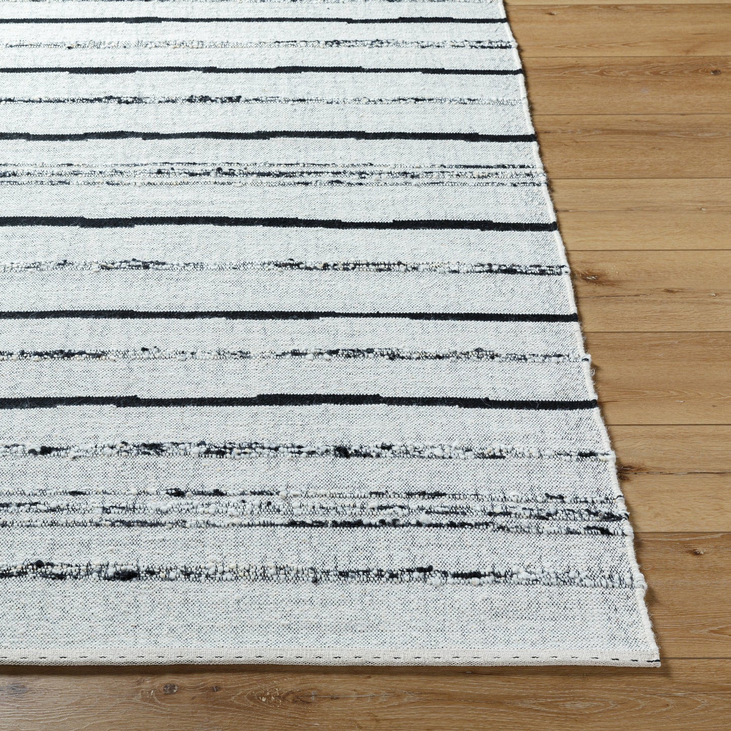 002 SI-2131753,SI-2131754,SI-2131755,SI-2131756 | Closeup | Goteborg GTG-2302 Rug by Surya in ivory, black. Made from face: 80% wool, 20% cotton, warp: 20% cotton in a unique style.