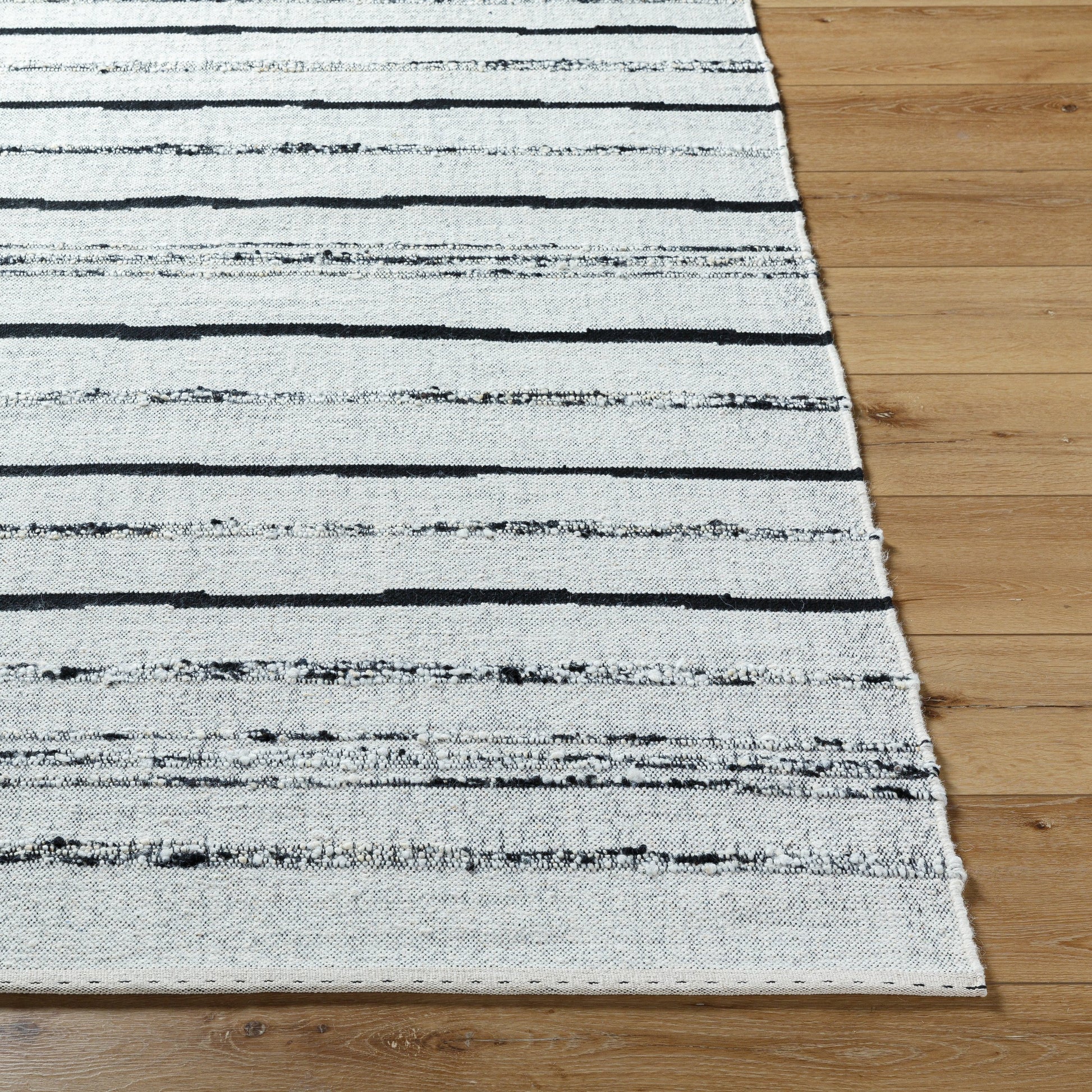 Goteborg GTG-2302 Rug by Surya in ivory, black. Made from face: 80% wool, 20% cotton, warp: 20% cotton in a unique style.