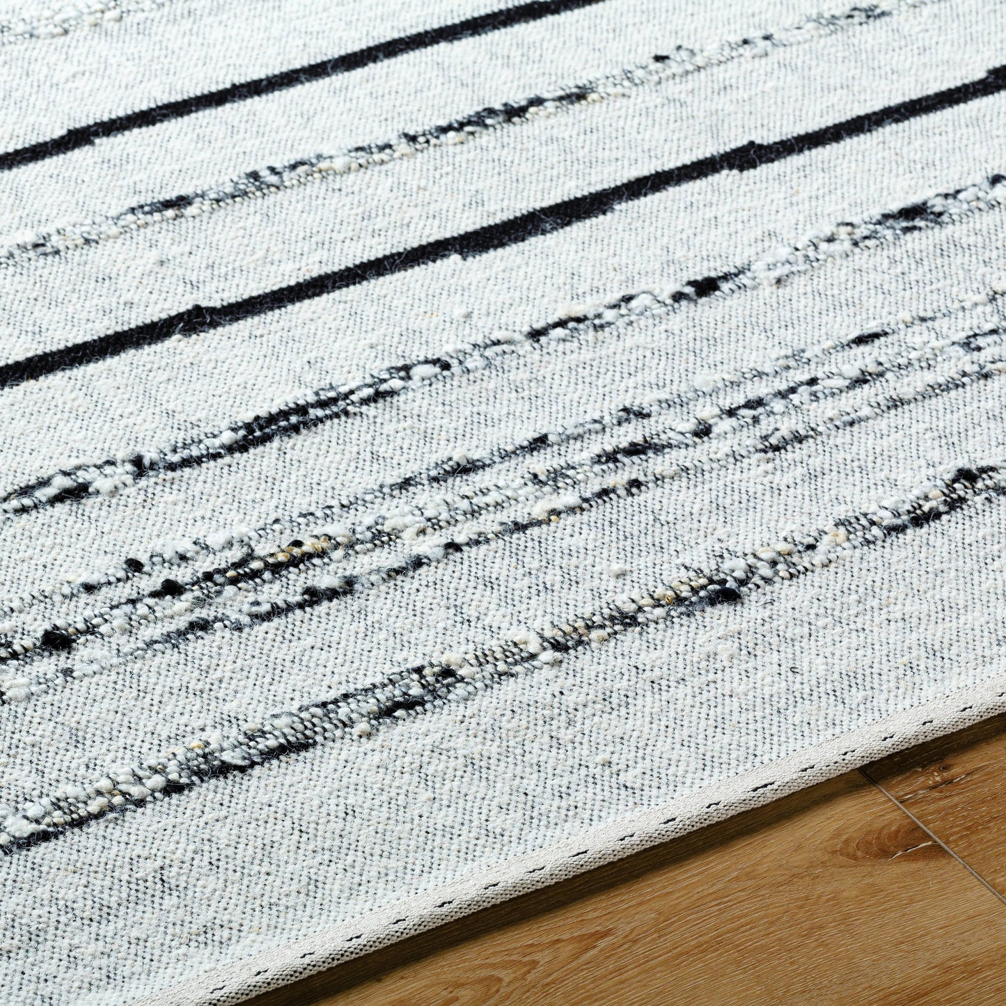 004 SI-2131753,SI-2131754,SI-2131755,SI-2131756 | Closeup | Goteborg GTG-2302 Rug by Surya in ivory, black. Made from face: 80% wool, 20% cotton, warp: 20% cotton in a unique style.