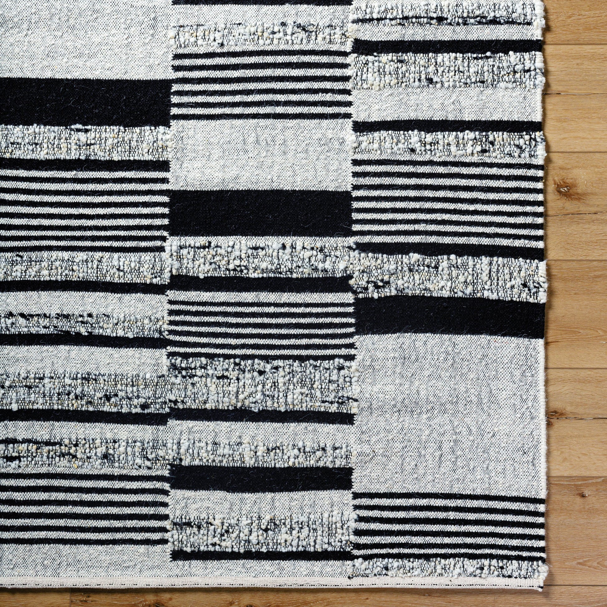 Goteborg GTG-2303 Rug by Surya in ivory, black. Made from face: 80% wool, 20% cotton, warp: 20% cotton in a unique style.