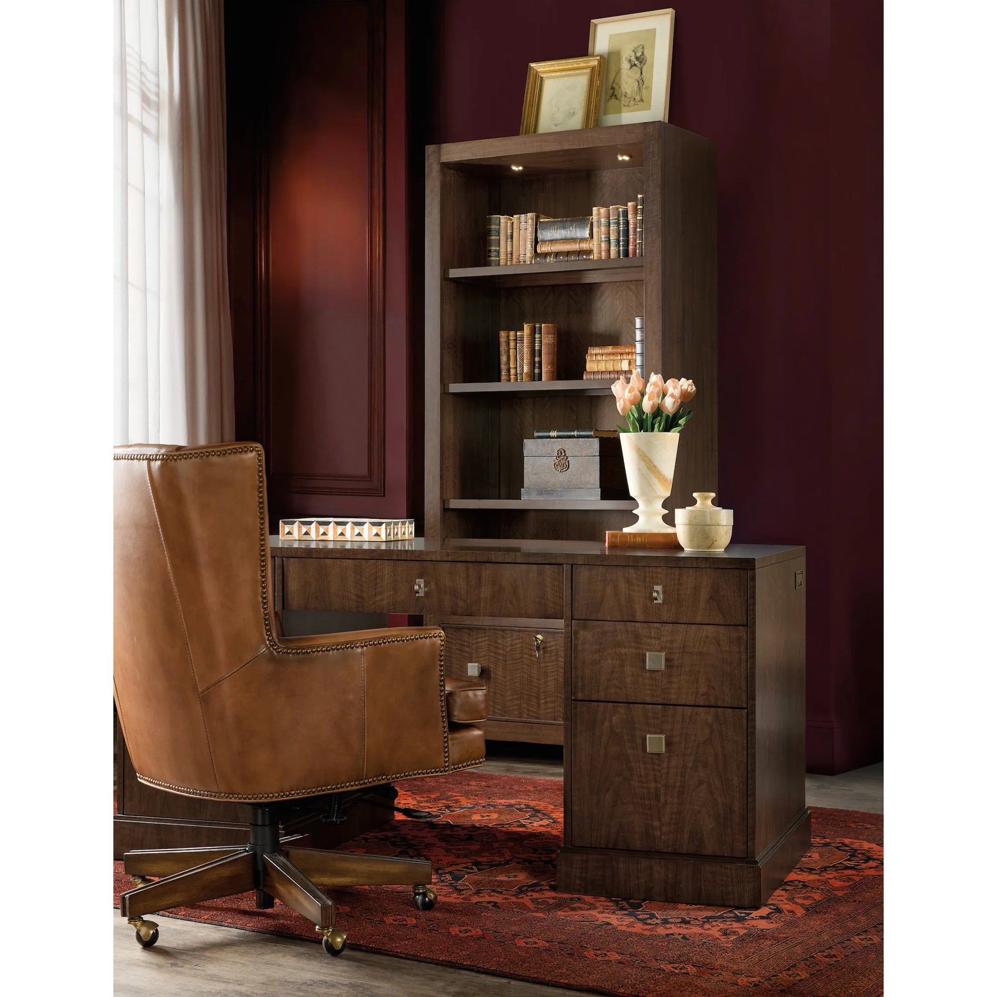 Archives Executive Desk by Hooker Furniture in classic walnut, walnut veneers. Made from leather, hair on hide leather, figured walnut veneers in a traditional style.