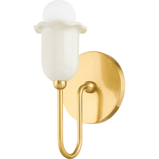 Delilah 1 Light Wall Sconce by Mitzi in aged brass. Made from ceramic in a modern style.