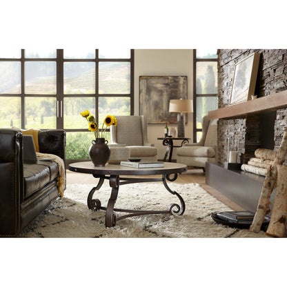 Luckenbach Metal & Stone End Table by Hooker Furniture in black. Made from cast iron, antique travertine in a traditional style.