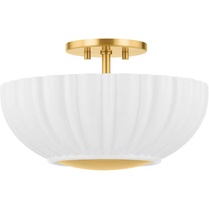 Anne Flush Mount by Mitzi in aged brass. Made from steel in a transitional style.