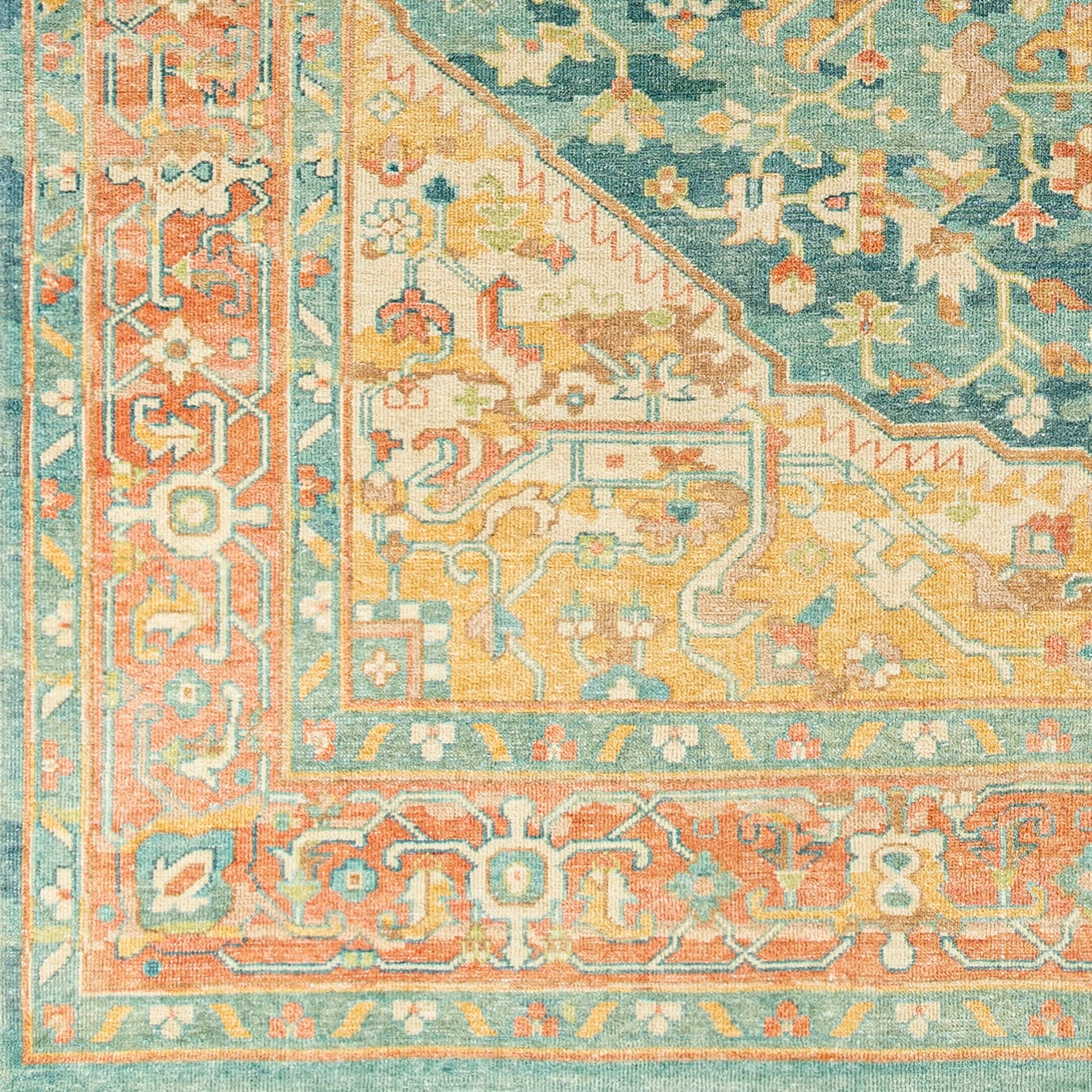 Hamadan Rug by Surya in saffron, camel, light beige, sage, tan. Made from 70% wool, 30% viscose in a traditional style.
