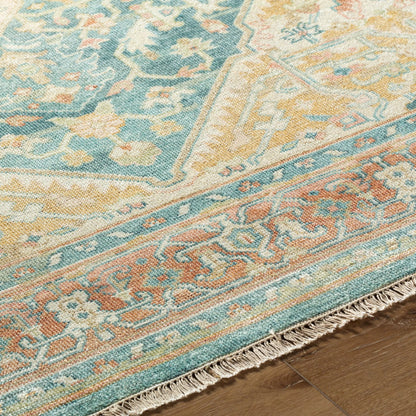 Hamadan Rug by Surya in saffron, camel, light beige, sage, tan. Made from 70% wool, 30% viscose in a traditional style.