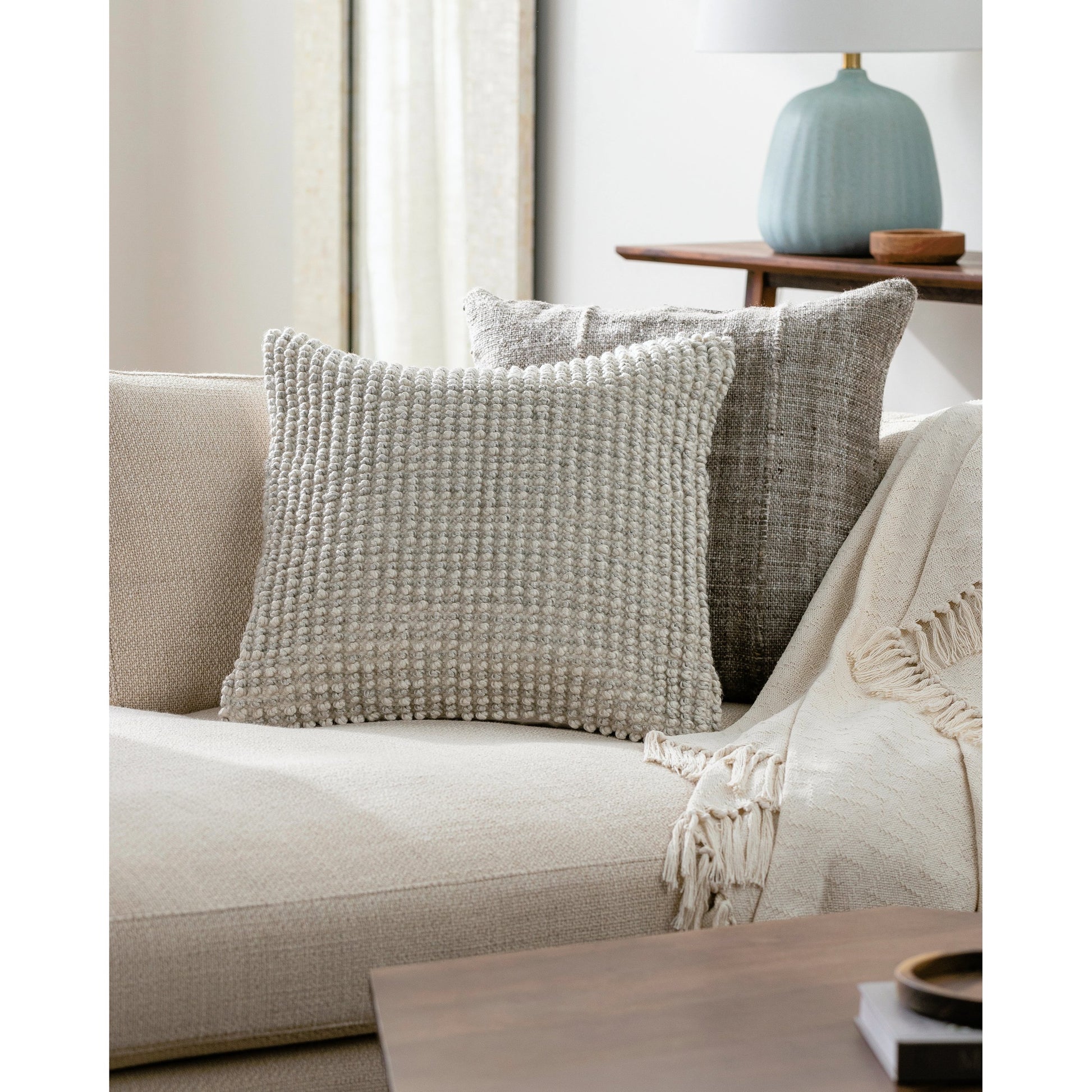 Haruko Indoor/Outdoor Pillow by Surya in ivory, pearl, cream. Made from front: 100% polyester, back: 100% polyester in a modern style.