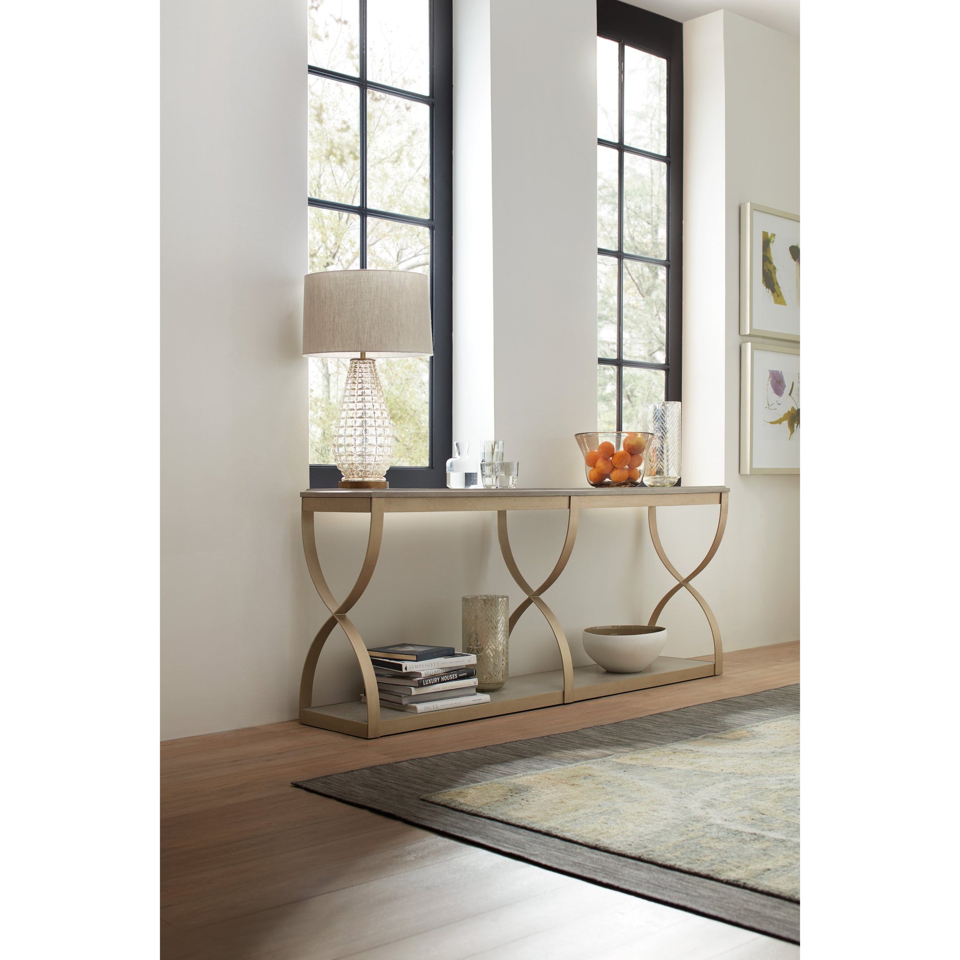 Elixir Console Table by Hooker Furniture in champagne silver. Made from basswood veneers, metal in a modern style.