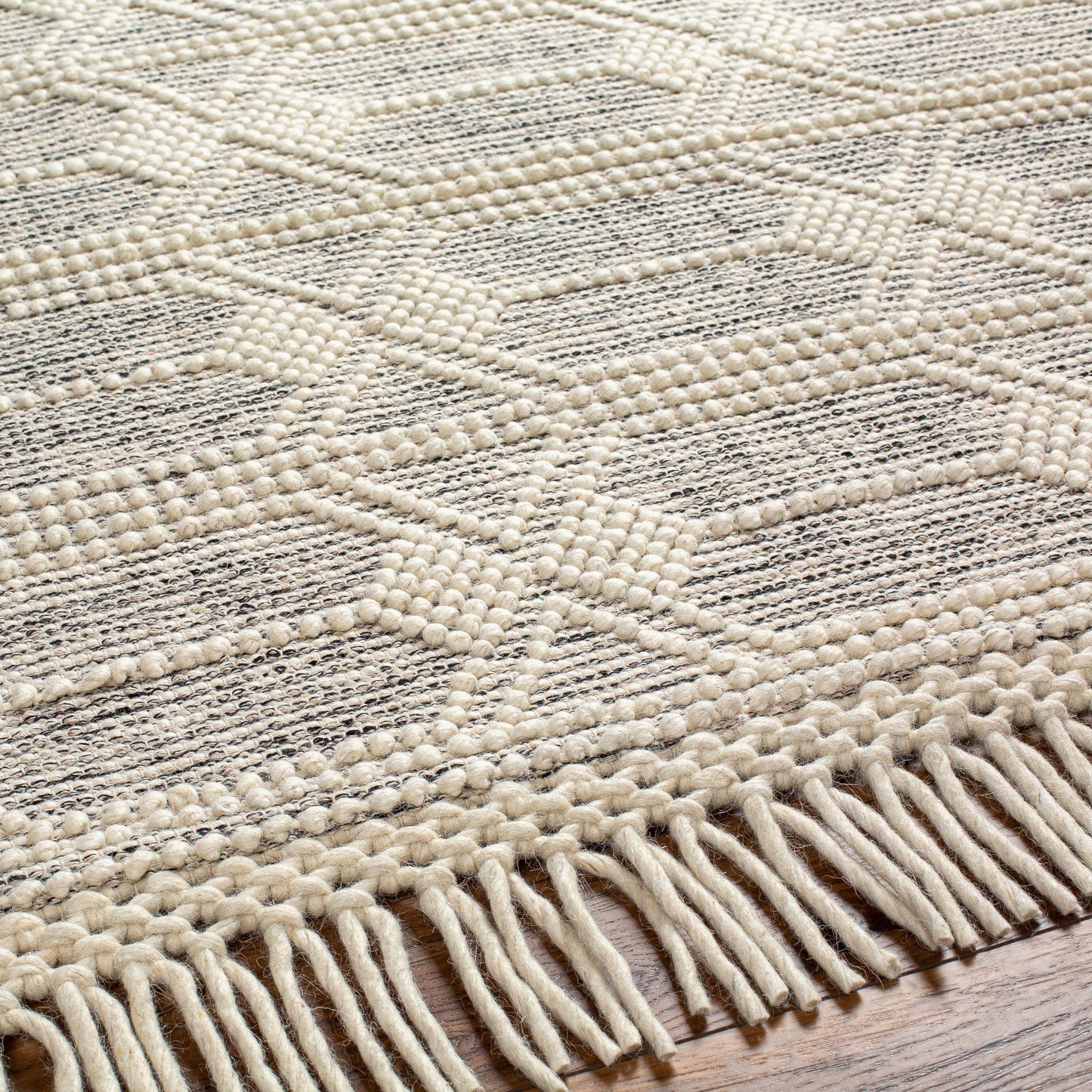 003 SI-1882581,SI-1882582,SI-1882583,SI-1882585,SI-1882587 | Closeup | Hemingway Rug - 31317 by Livabliss in ivory, black. Made from 60% wool, 40% polyester in a unique style.
