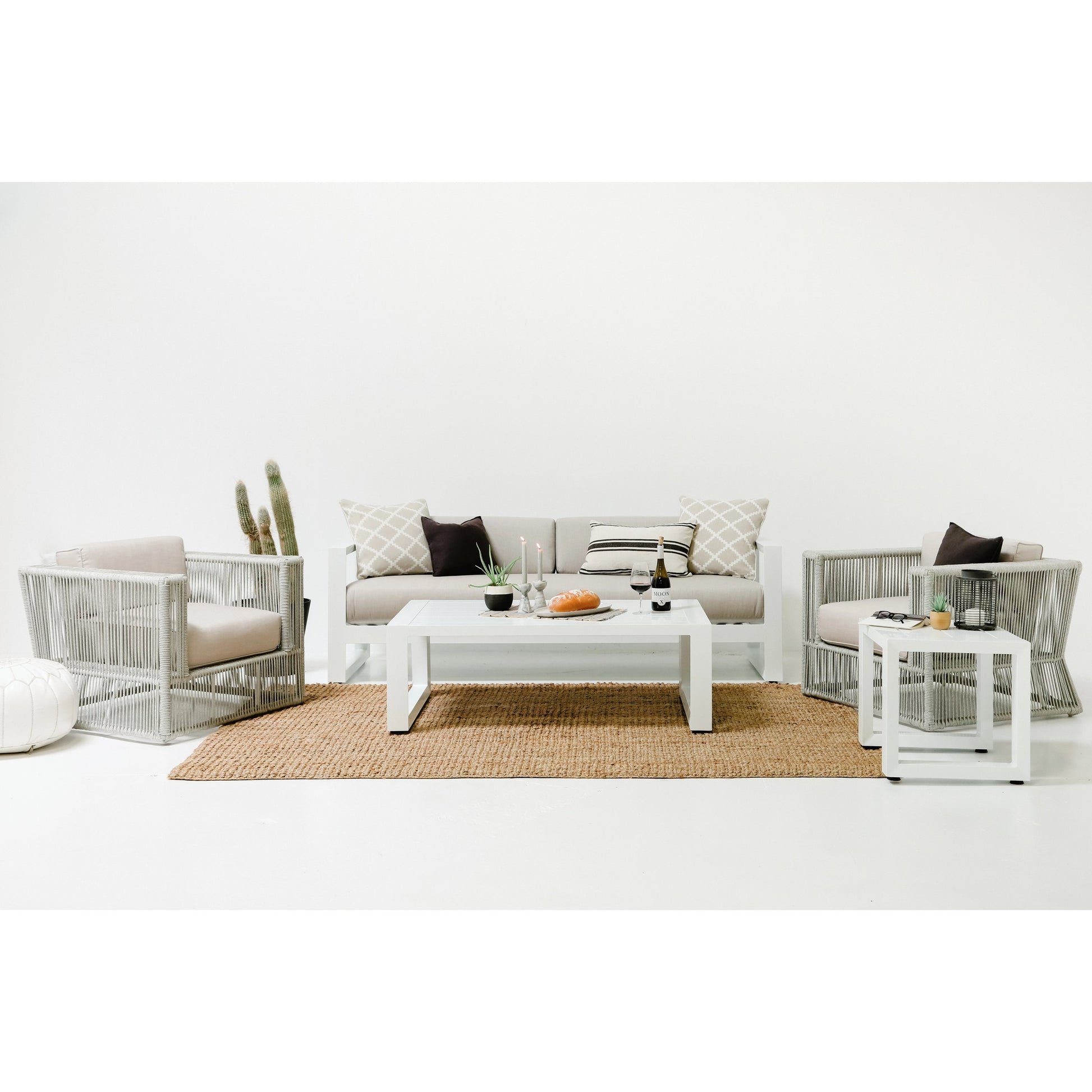 Newport Outdoor Ottoman by Sunset West in whites/creams/beiges. Made from aluminum in a modern style.