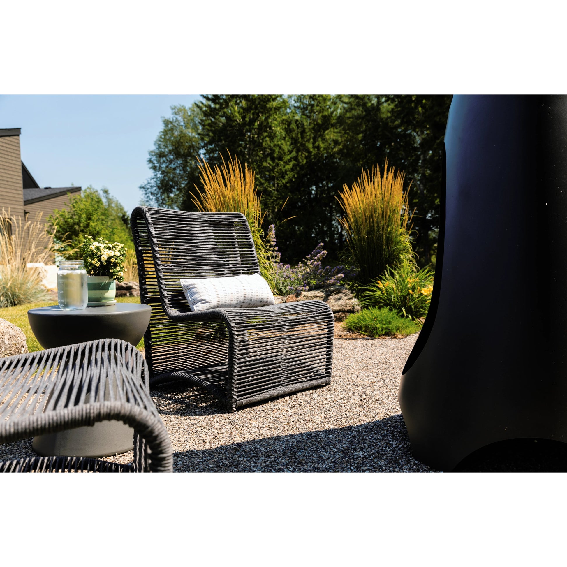 Milano Outdoor Armless Club Chair by Sunset West. Made from olefin rope in a coastal style.