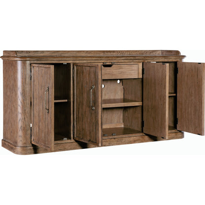 Americana Four-Door Buffet by Hooker Furniture in brown and honey finish. Made from oak veneers with solid-wood edge top in a rustic style.
